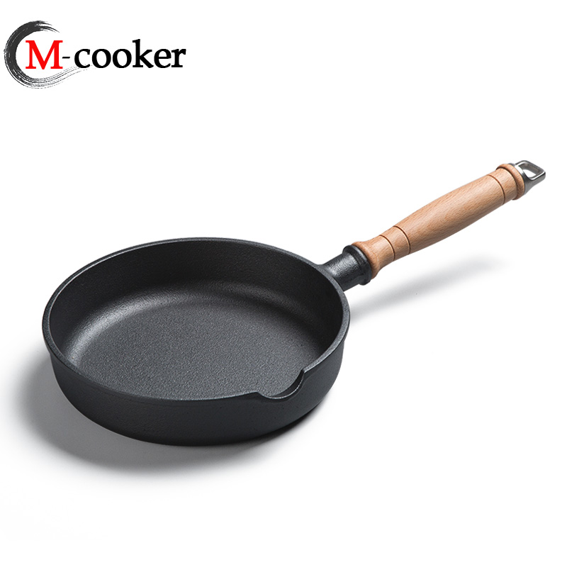 Cast iron fry pan with wooden handle