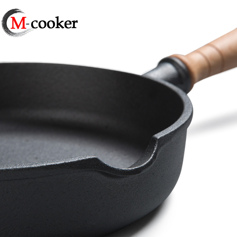 Cast iron fry pan with wooden handle
